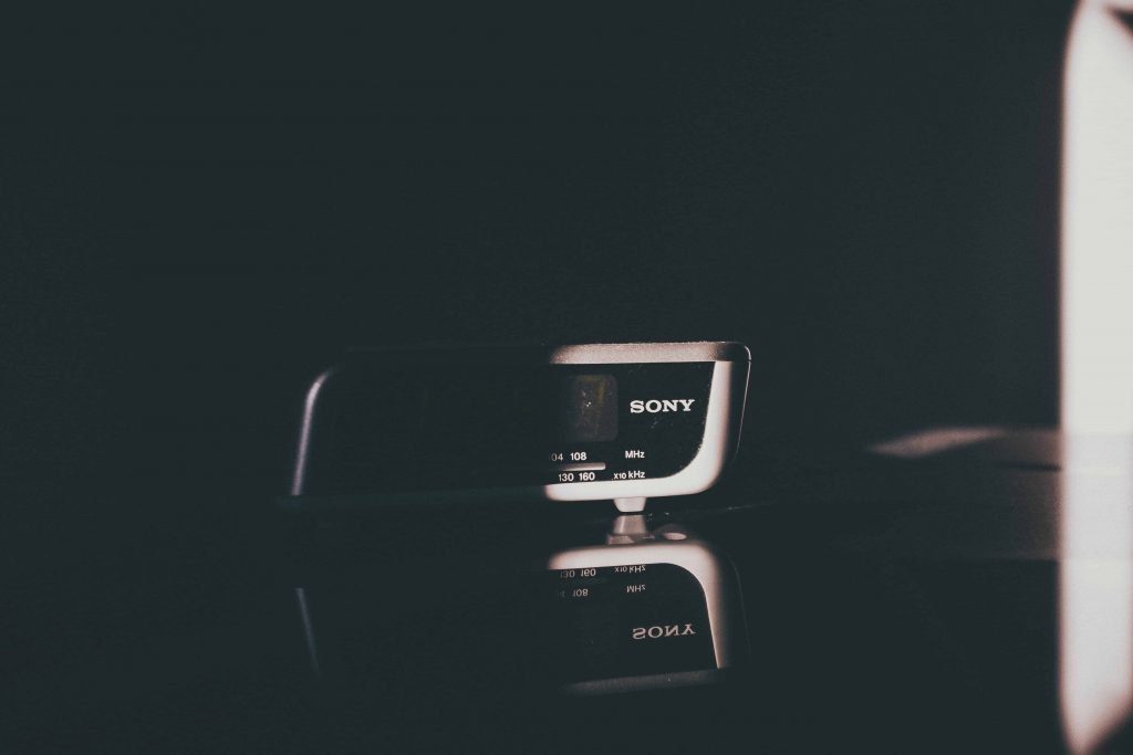 Radio alarm clock in a dark bedroom