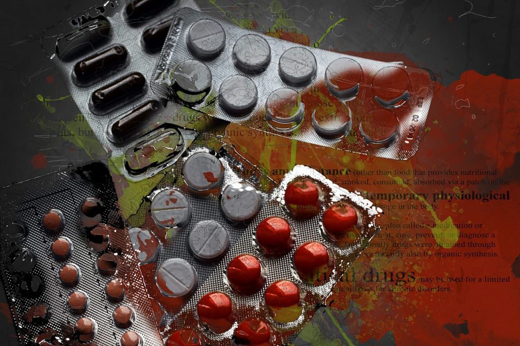 Big Pharma wants you sick - picture of lots of prescription medications with blood on them